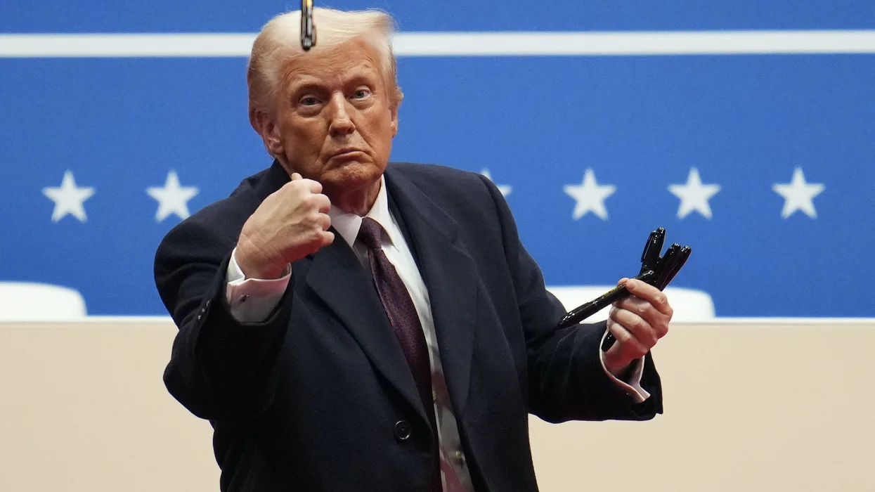 Trump tosses pens to audience after signing executive orders on climate change, free speech, inflation, and others